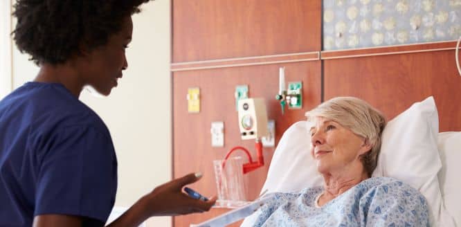 bigstock.Nurse.Talking.To.Senior.Female.114155252